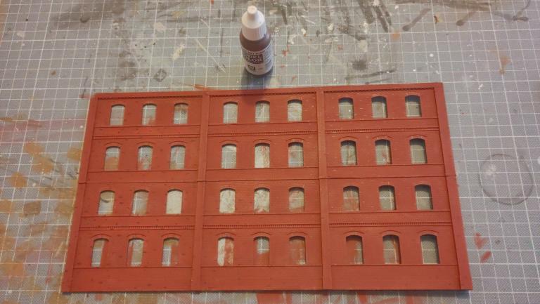 Paint a couple of bricks in Burnt Umber